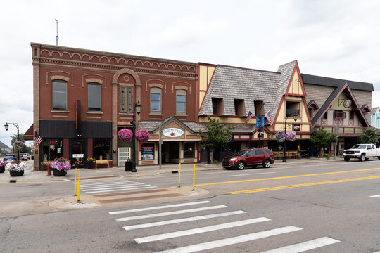 Gaylord, Michigan, USA - 25 Jul 2026 : Historic downtown street view of Gaylord, Michigan, featuring Alpine-style architecture, local shops, restaurants, and floral streetscape displays.