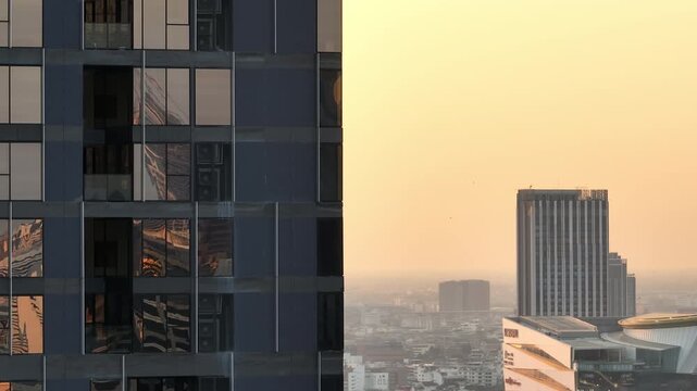 sunset time golden hour bangkok city modern building front cityscape aerial panorama 4k thailand 