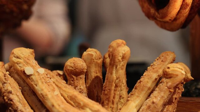 Crispy breadsticks displayed in a bakery shop. Golden baked wheat snack for appetizer. Rustic artisan food arrangement for catering service and culinary tradition.