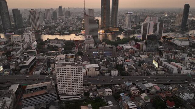 sunset evening time bangkok city riverside center traffic road overpass aerial panorama 4k thailand 