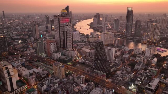 sunset time bangkok downtown cityscape riverside traffic aerial panorama 4k thailand 