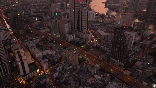 sunset time bangkok downtown cityscape riverside traffic streets aerial panorama 4k thailand 