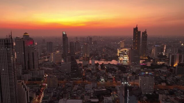 sunset sky twilight bangkok downtown cityscape riverside modern mall aerial panorama 4k thailand 