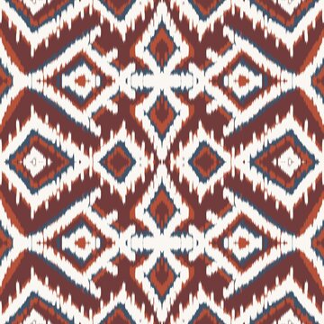 Seamless ethnic ikat pattern with bold yellow, teal blue, and terracotta geometric diamond motifs on an ivory background. Tribal fabric design perfect for bohemian prints, wallpaper, and decor.