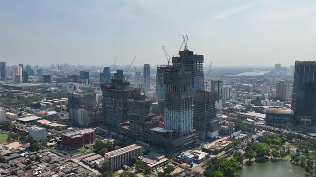 sunny day bangkok city downtown mega mall office complex construction exterior aerial panorama 4k thailand 