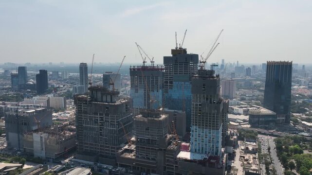 sunny day bangkok city downtown mega mall office complex construction exterior aerial panorama 4k thailand 