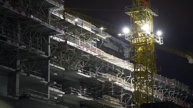 night time illuminated abu dhabi new modern construction working crane panorama 4k united arab emirates