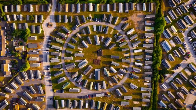 Aerial view of Camber Sands and coastal caravan parks beside farmland in East Sussex; ideal for travel, tourism, property, holiday and lifestyle advertising