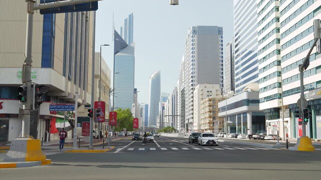 sunny day abu dhabi city downtown traffic street crossroad slow motion panorama 4k united arab emirates