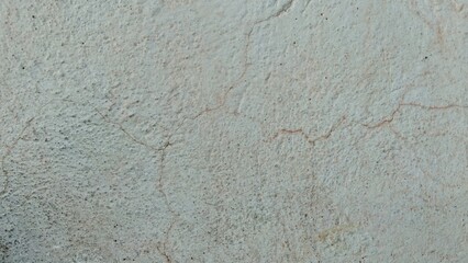 Fototapeta premium Cracked concrete wall surface background texture with rough stucco pattern