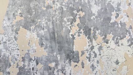 Fototapeta premium Grunge weathered concrete wall texture with peeling cream paint and cracked surface