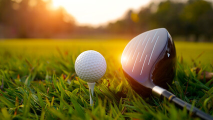 Fototapeta premium Golf clubs and balls on a green lawn in a beautiful golf course with morning sunshine.