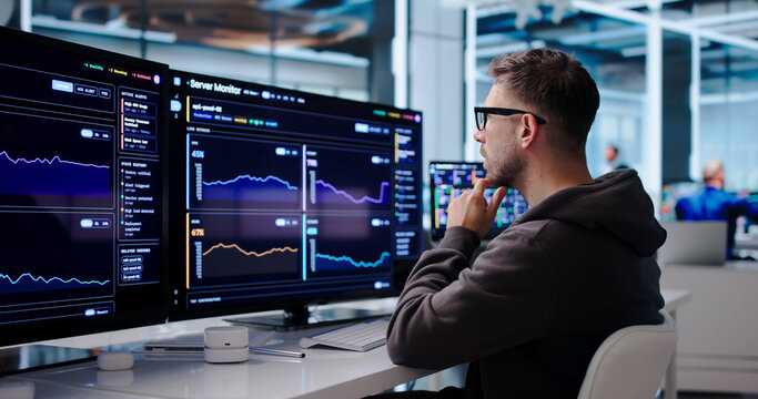 Young IT Technician Tracks Real-time Server Performance
