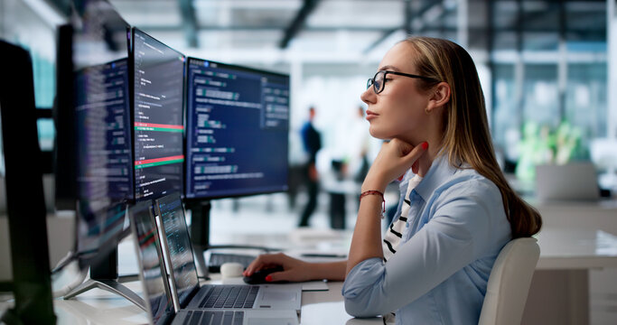 Woman Software Developer Reviews Code Changes Using Visual Merge Tool