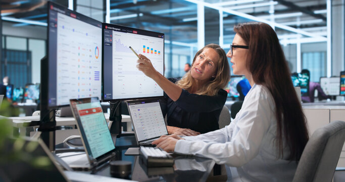 Woman In IT Center Reviews Incident Alerts