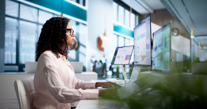 Young Financial Analyst Studying Dashboard Data On Laptop