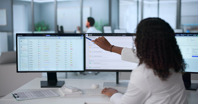 Young African Doctor Using Computer