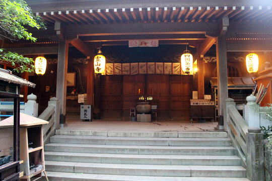 sacred main hall entrance at Ryozenji Temple with glowing paper lanterns, Shikoku Pilgrimage in Naruto, Tokushima, Japan July 2026.