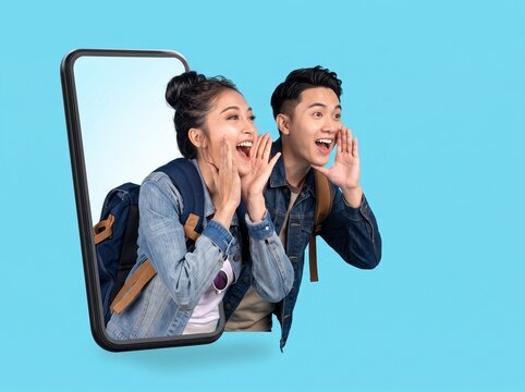 A young Asian couple wearing denim jackets and carrying backpacks excitedly shouting out from a smartphone screen against a light blue studio background