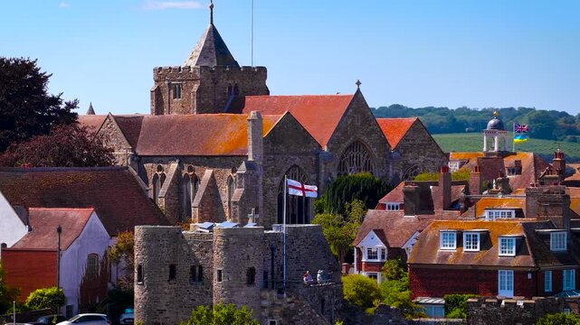 View of Rye cathedral and Ypres Tower rising above historic rooftops in East Sussex, England, in bright daylight; ideal for travel, heritage and tourism marketing