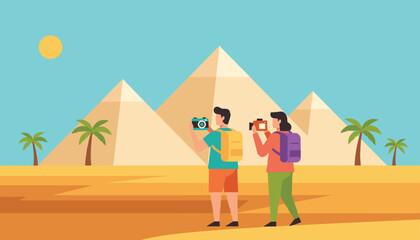 Fototapeta premium Two young tourists with backpacks taking photos of the grand pyramids in the desert during their trip to Egypt.