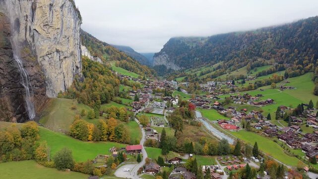 Aerial view of Lauterbrunnen alpine village and Staubbach Falls in autumn. Canton of Bern, Switzerland.