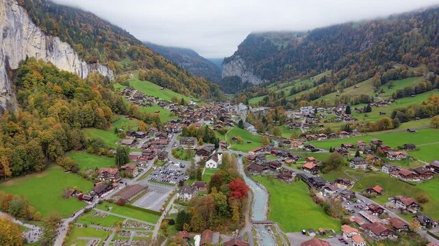 Aerial view of Lauterbrunnen alpine village and Staubbach Falls in autumn. Canton of Bern, Switzerland.