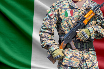 Fototapeta premium Italy flag with soldier holding assault rifle