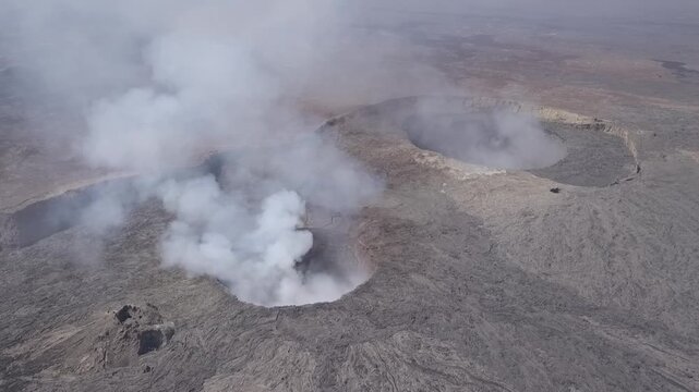Erta Ale volcano, View of the glowing lava lake inside the crater, with molten rock patterns and dark volcanic rock walls in Zone 2, Afar, Ethiopia.