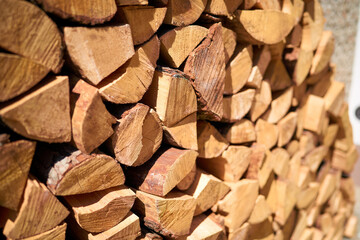 Fototapeta premium Natural wooden logs prepared for fireplace season