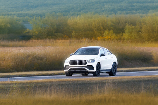 Sport utility vehicle cruising through nature