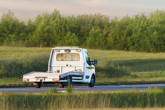 Flatbed trailer truck on open countryside road