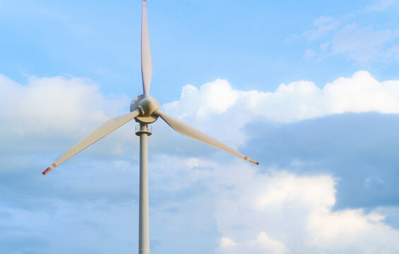 Wind turbine generating clean energy in field