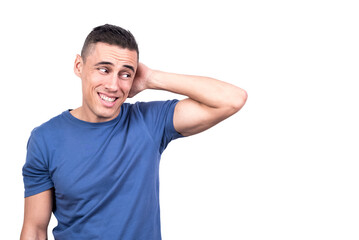 Obraz premium Shy man with his hand on his neck dissimulating