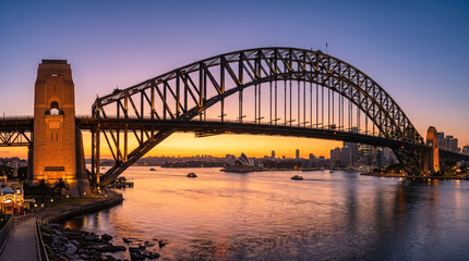 Naklejka premium Pont de Sydney au coucher du soleil sur la baie