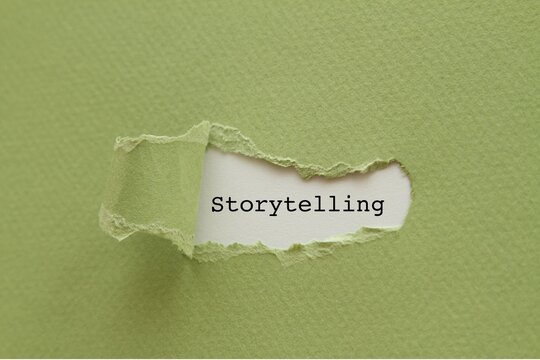 Close-up of torn paper with storytelling text. Creative concept for communication and ideas.