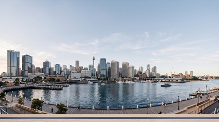 Obraz premium Sydney skyline panorama with waterfront promenade and boats at sunset