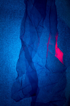 Transparent thin handkerchief on a blue background