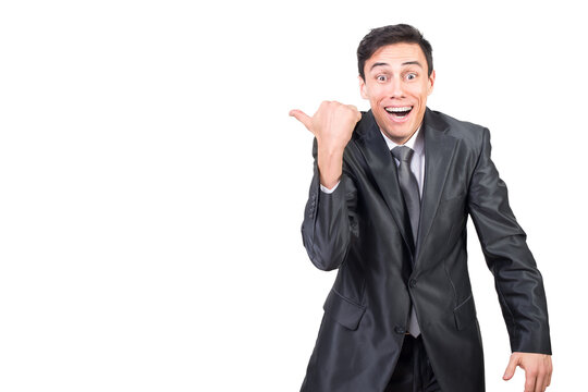 Cheerful businessman pointing aside and smiling happily