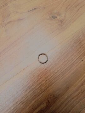 wood texture background and the ring on top