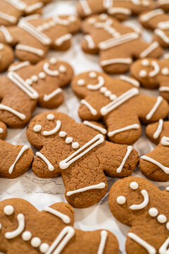 Decorating Gingerbread Man Cookies with Royal Icing for Festive Occasions