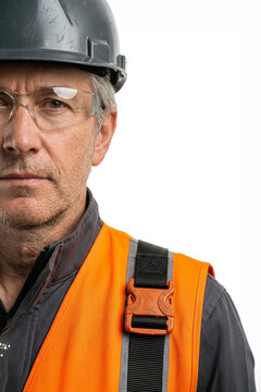 Construction worker wearing safety helmet and protective glasses