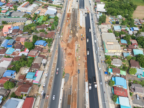 Aerial Photo of Urban Highway Expansion Construction with Fresh Asphalt and Traffic