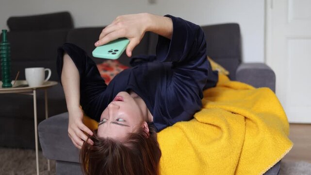 Instead of restoring energy a young woman stays trapped in endless phone scrolling chasing quick dopamine hits that leave her mentally drained and emotionally exhausted