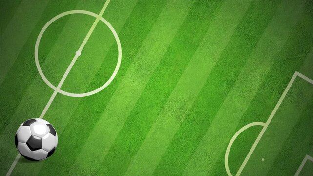 Animated soccer ball on a green football field. Clean composition with large copy space below the ball for text or graphic placement
