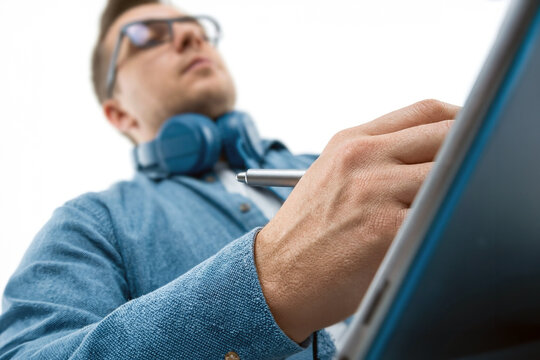 Man using a digital tablet with a stylus