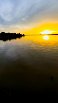 Golden Sunset Over Calm River Water