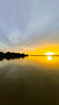 Golden Sunset Over Calm River Water