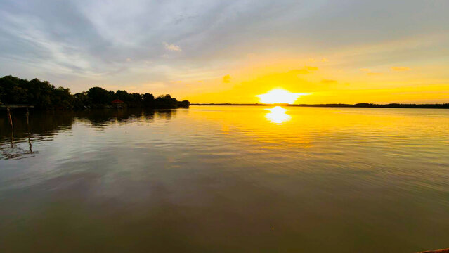 Golden Sunset Over Calm River Water