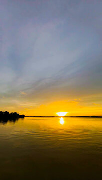 Golden Sunset Over Calm River Water